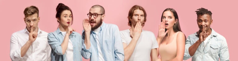 The young men and women whispering a secret behind hands over pink background