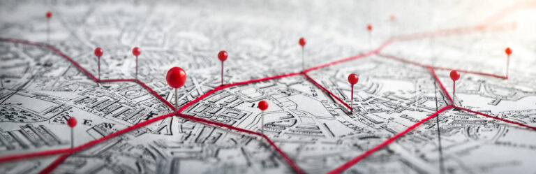 Routes with red pins on a city map. Concept on the  adventure, d